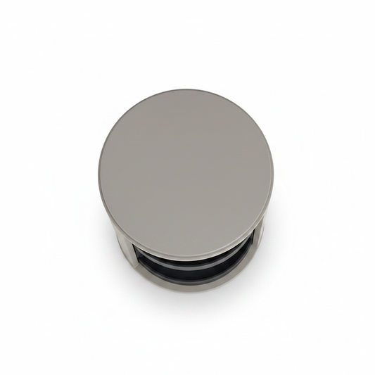 Top view of light grey cylindrical rotating bedside table showing dark charcoal open shelves
