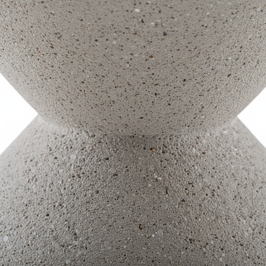 Close-up of Zeta Stool matte concrete texture and pinched waist where the two cone forms meet