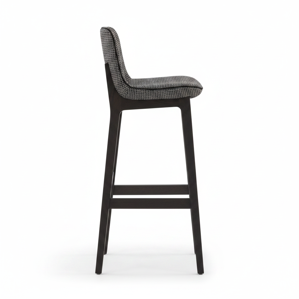 Side view of dark charcoal woven fabric bar stool showing slim shell back and wood frame