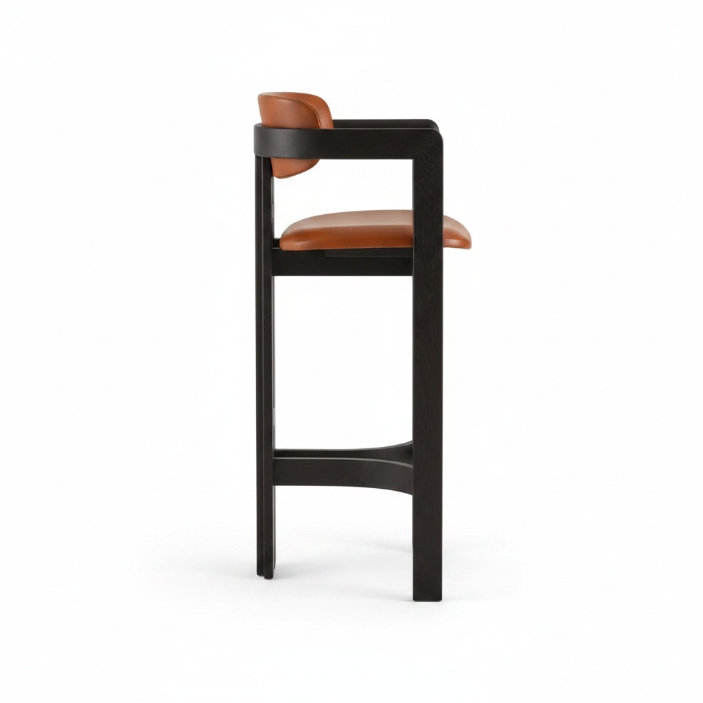 Side view of cognac leather armed bar stool showing H-shaped cross stretcher and black wood frame