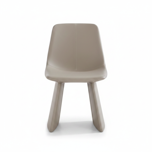 Front-facing studio shot of the Lama Leather Dining Chair in greige with sculptural blade legs