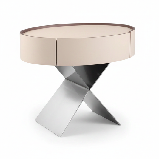 Cream matte round cylindrical bedside table with one drawer on polished chrome X-shaped crossed base, front view on white background