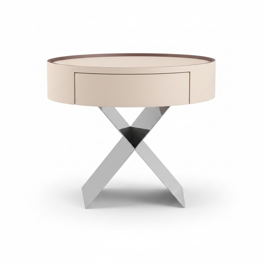 Side view of cream matte cylindrical bedside table showing sculptural X-shaped polished chrome base
