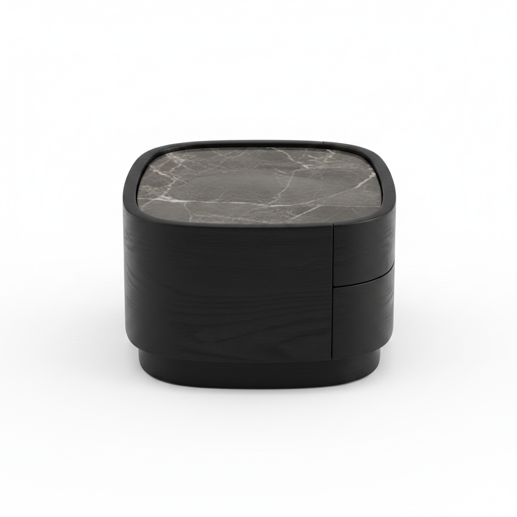 Side view of low rounded matte black bedside table with marble top and plinth base