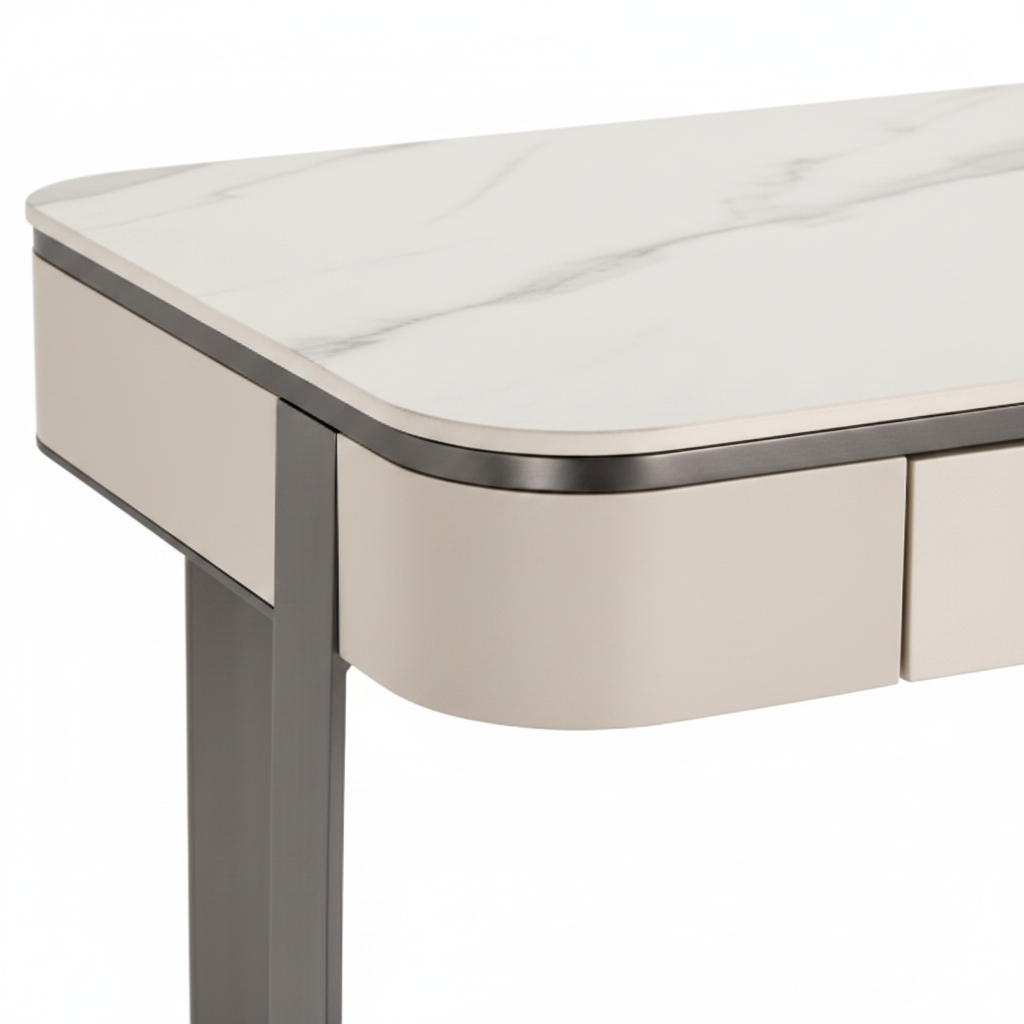 Close-up of white sintered stone top, dark gunmetal trim and cream lacquer drawer detail