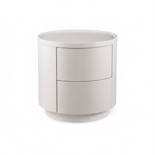 Warm white matte cylindrical two-drawer handleless bedside table on round disc base, front view on white background