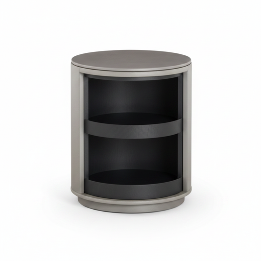 Light grey cylindrical rotating bedside table with dark charcoal open shelves, front view on white background