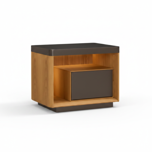 Warm natural oak bedside table with open dark charcoal niche shelf and flush charcoal drawer on dark plinth base, front view on white background