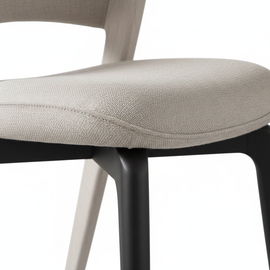 Vela Dining Chair fabric texture and wood leg close-up