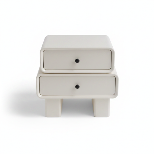 Top view of warm cream matte bedside table with black knob handles on chunky legs