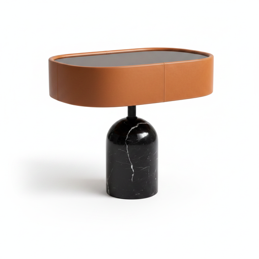 Cognac leather oval top side table with smoked glass inset on solid black marble bell pedestal base, front view on white background