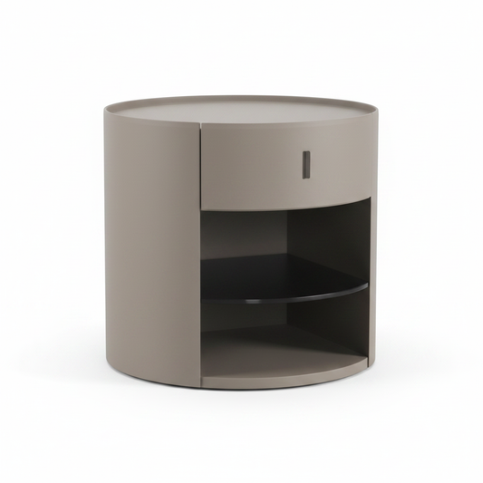 Warm taupe greige cylindrical bedside table with one drawer and open curved shelf, front view on white background