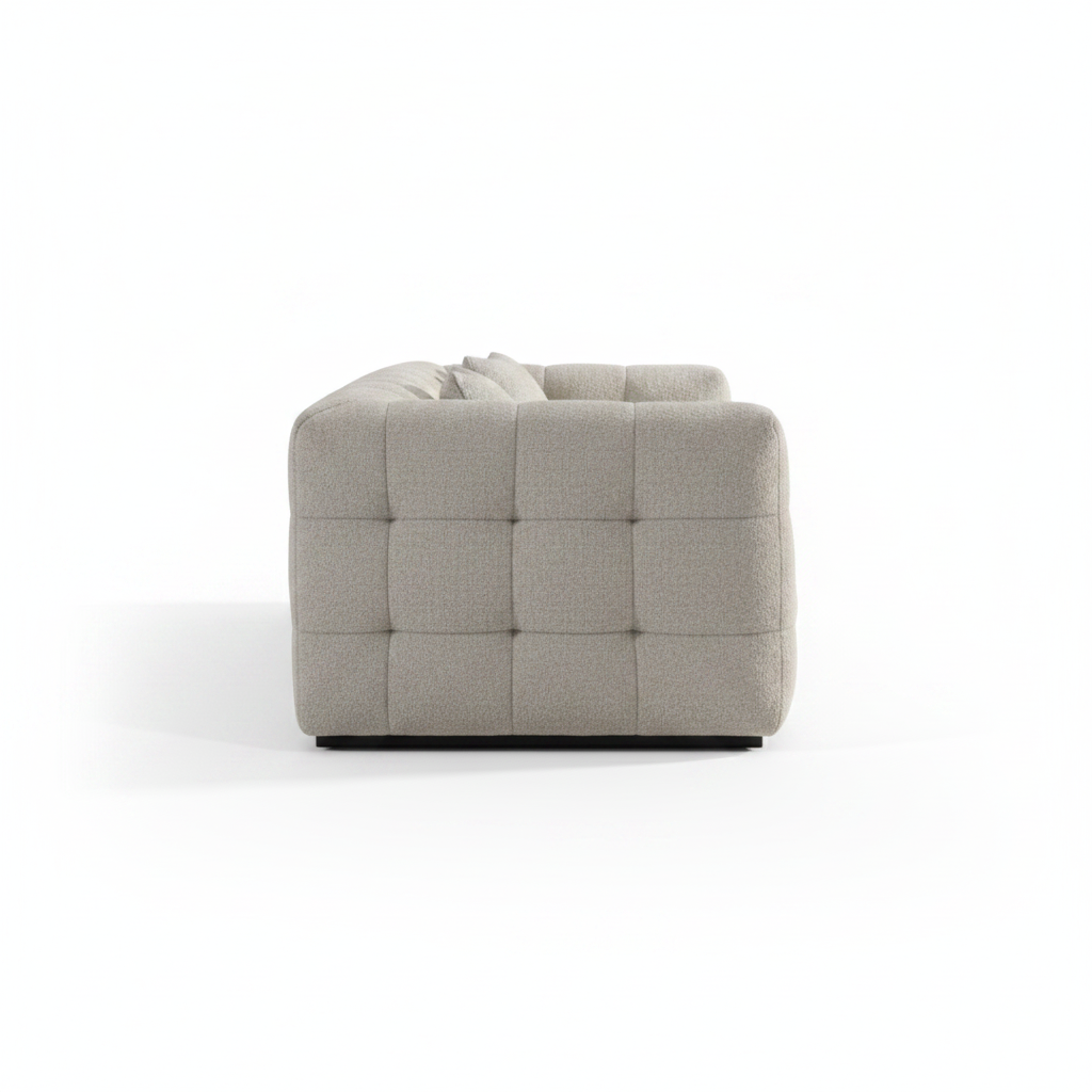 Alveo Sofa side profile, grid-tufted grey fabric, white background