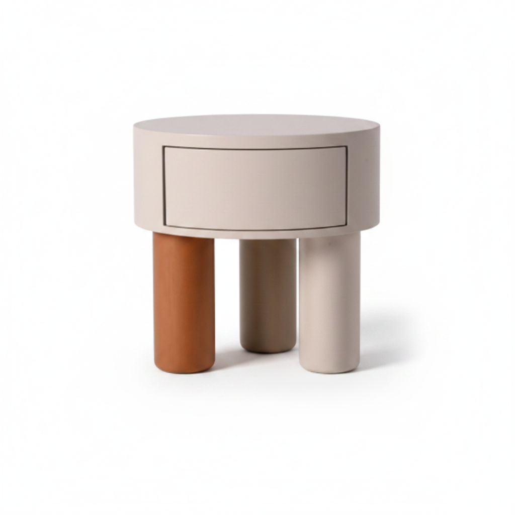 Cream cylindrical bedside table with one flush drawer on three cylindrical legs in terracotta, cream, and grey, front view on white background