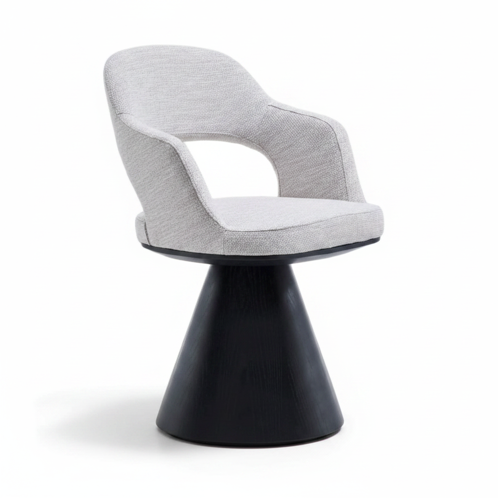 Three-quarter angled view of the Volta Dining Armchair showing the open back shell and cone pedestal base