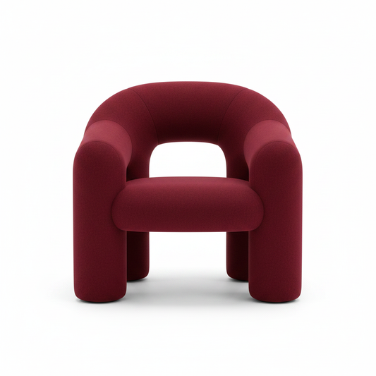 Sculptural crimson red tubular lounge armchair with chunky cylindrical legs and open back on white background