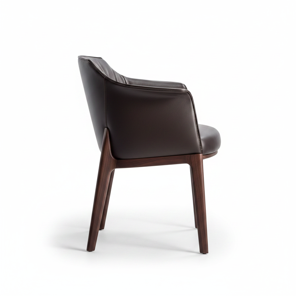 Side profile view of the Arcadia Dining Armchair showing the seat depth and tapered walnut legs