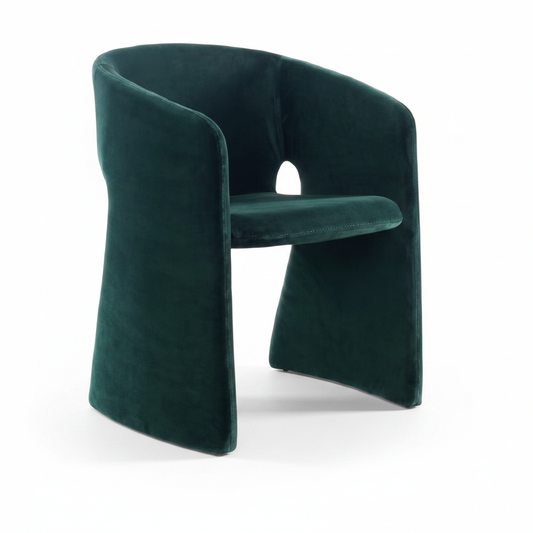 Three-quarter angled view of the Grotto Velvet Barrel Dining Chair showing the keyhole cutout and flared base