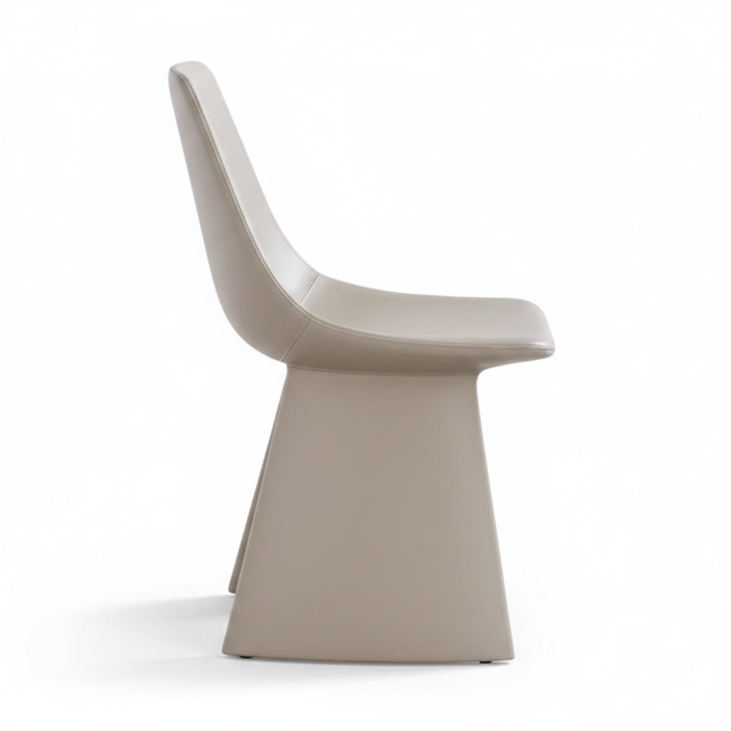 Side profile view of the Lama Leather Dining Chair showing the shell curve and blade leg silhouette