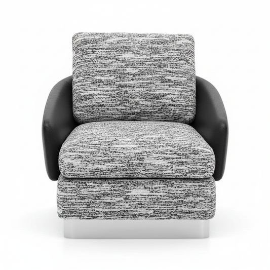 Lounge armchair with black and white boucle fabric cushions, matte black leather shell and brushed silver plinth base on white background