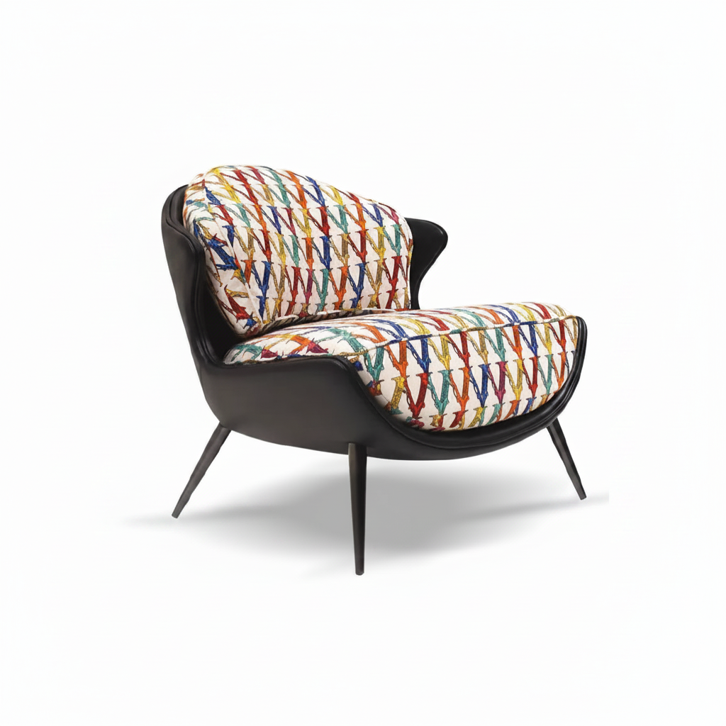 Mid-century lounge armchair with matte black leather shell and vibrant multicolour graphic print cushions on white background