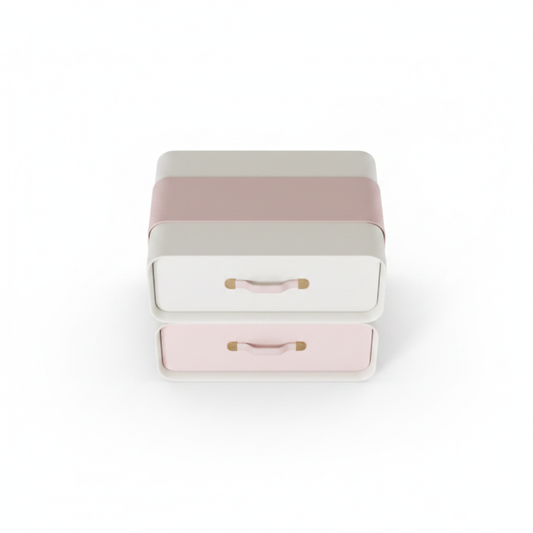 Top view of cream matte stepped bedside table with blush pink drawer fronts