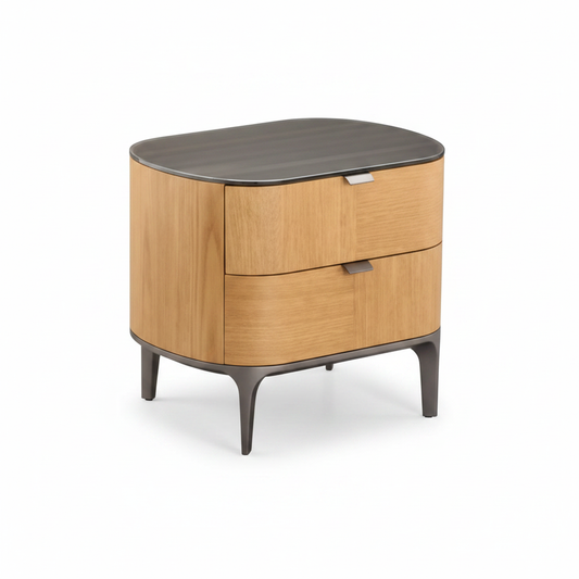 Side view of warm oak veneer rounded bedside table with smoked glass top and slim dark metal legs